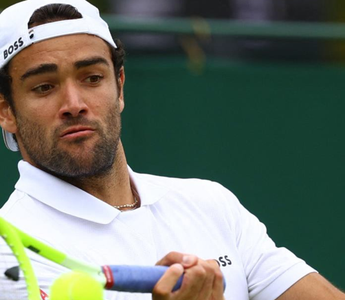 Matteo Berretini wearing Boss apparel playing tennis